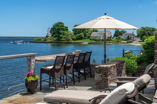 3 bedroom, 2 full bathroom water view and ocean front property. Outdoor kitchen and lounge chairs.