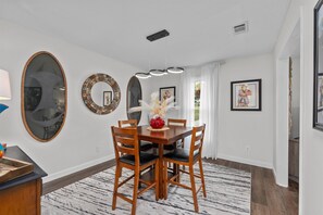 Dining - 4 bedroom, 2 bathroom home with partially fenced backyard that allows pets. The sleeping arrangements for this property are 4 queen beds. (Augusta)