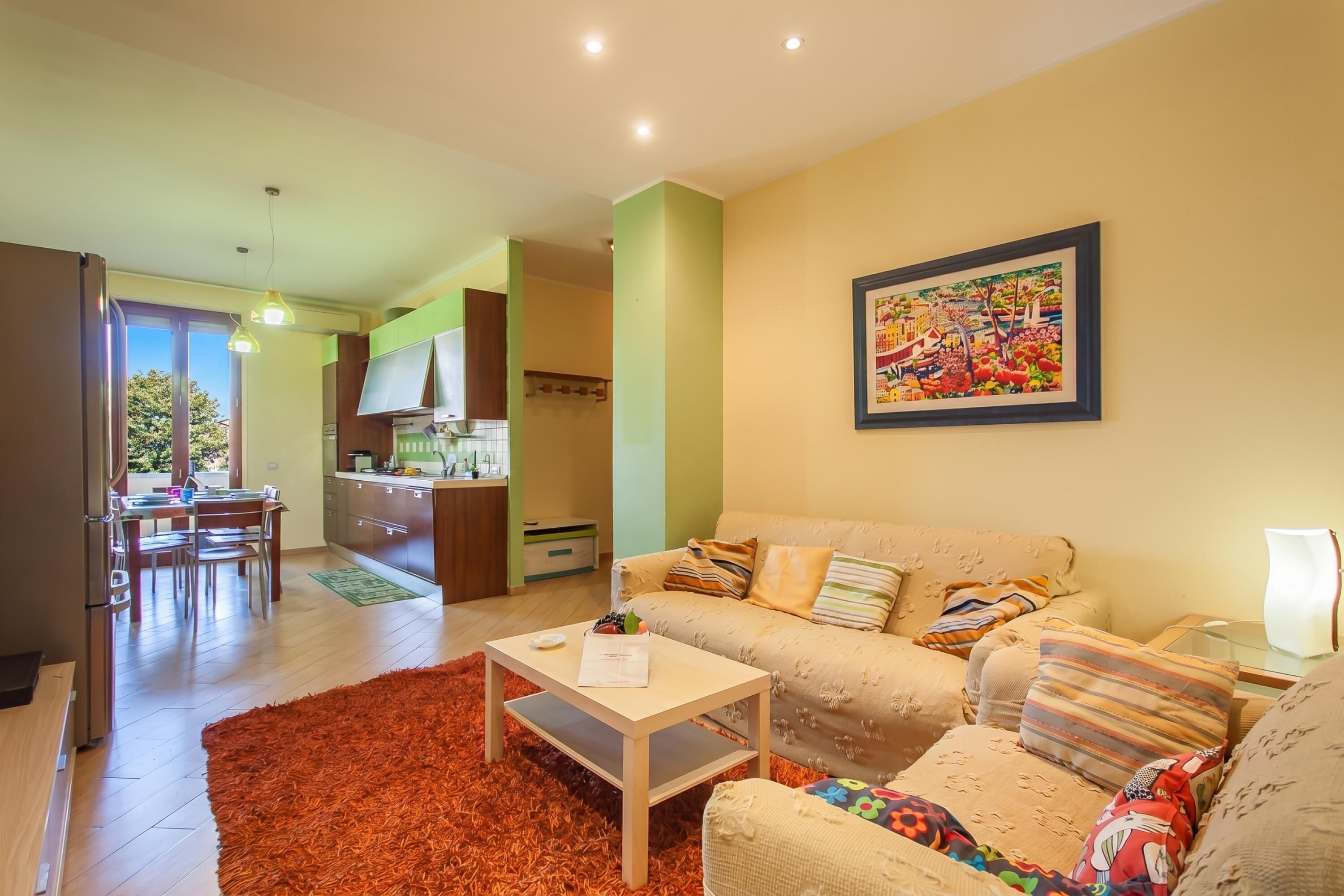 Family Apartment, 2 Bedrooms, Balcony (Happy Apartment Nettuno Close To Sea) | Living area | Flat-screen TV