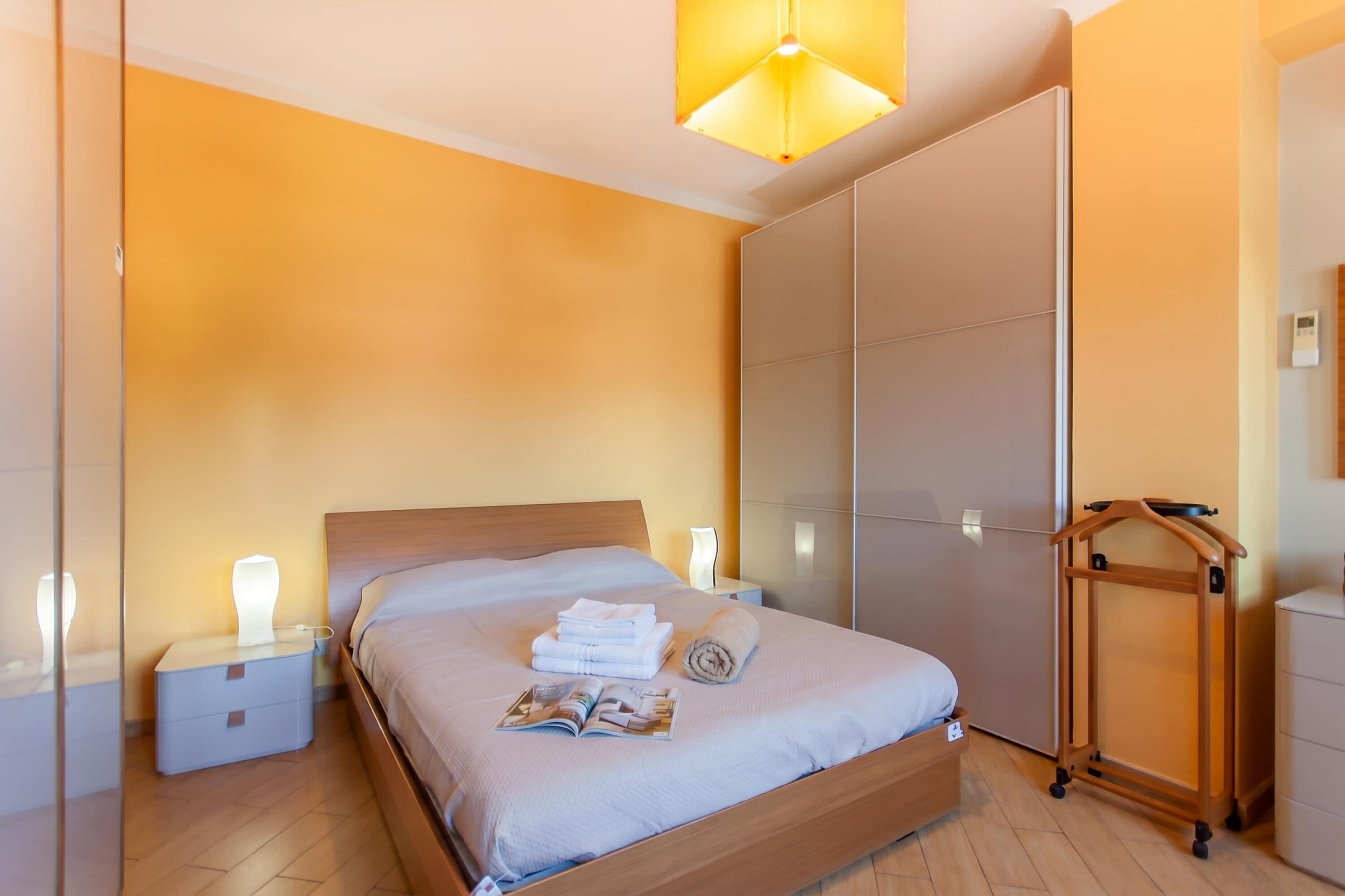 Family Apartment, Multiple Bedrooms (Happy Apartment Nettuno Close To Sea) | 2 bedrooms, laptop workspace, iron/ironing board, bed sheets