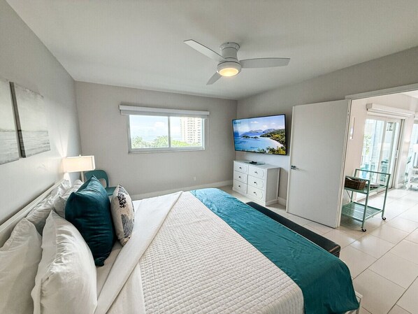 Bedroom #1 with a King-size Casper memory foam mattress and a 65" roku enabled smart tv