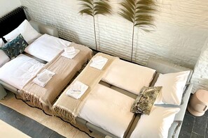 1 bedroom, desk, iron/ironing board, travel crib