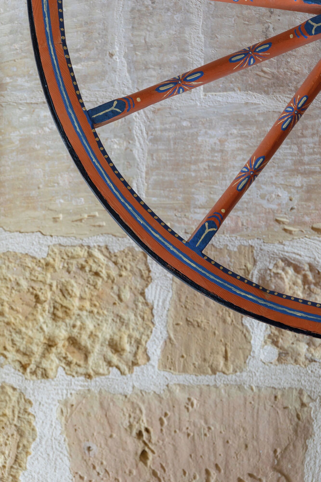 A close-up of a wheel with a decorative pattern.