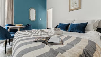 1 bedroom, desk, iron/ironing board, travel crib