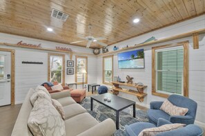 Smart TV, books - `Unwind on the covered front porch with a bistro table, fire up the BBQ grill, and enjoy outdoor dining. Take a refreshing dip in the community’s heated/cooled pools while embracing the coastal vibe.` (Port Aransas)