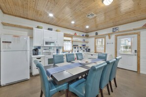 Dining - `Unwind on the covered front porch with a bistro table, fire up the BBQ grill, and enjoy outdoor dining. Take a refreshing dip in the community’s heated/cooled pools while embracing the coastal vibe.` (Port Aransas)