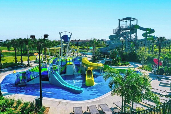 A water park with multiple slides and a large water play area.