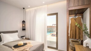 A hotel room with a bed, a nightstand, a hanging light fixture, a view of the pool, and a wooden cabinet with a plant. - Stefi Deluxe Villas - Avgi Private Pool Retreat (Anopoli)