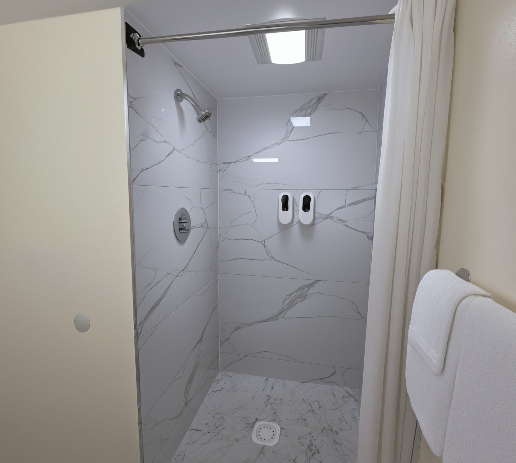 A shower with a glass door, a handheld showerhead, and a wall-mounted faucet.