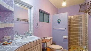 Shower, hair dryer, towels, shampoo