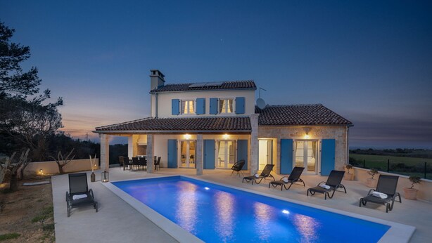A two-story house with a swimming pool, outdoor seating, and a view of the countryside. - Villa Mediterra Prima Zadarvillas (Nin)