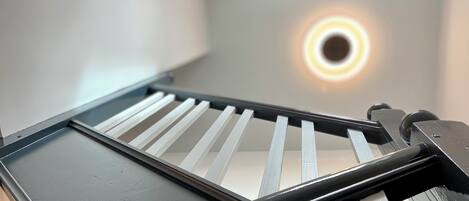 A close-up of a sliding door with a circular light fixture above it.