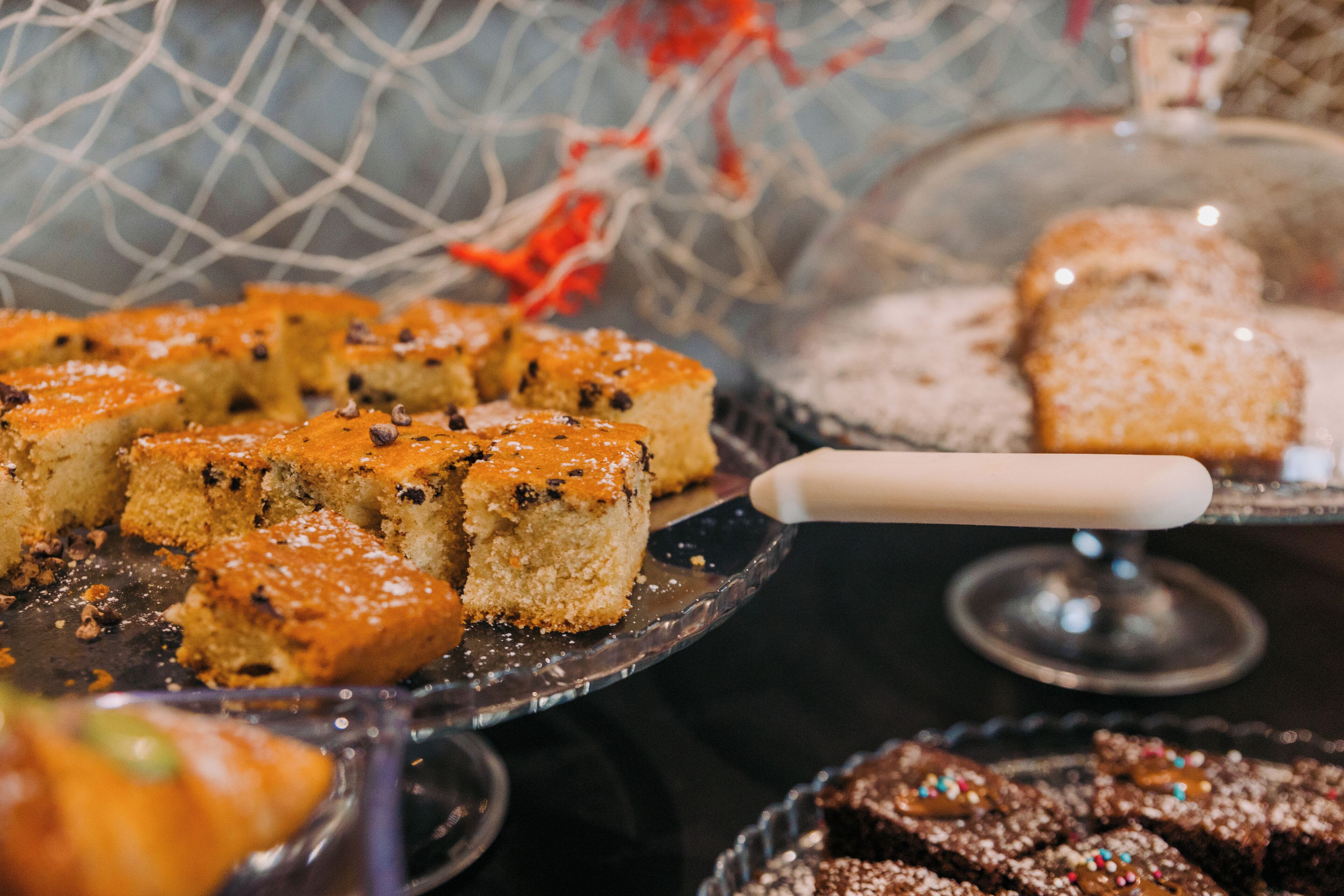 A dessert display with various types of cakes and pastries.