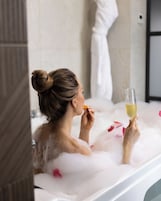 Luxury Room | Bathroom | Hair dryer, slippers, bidet, towels