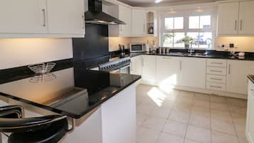 Fridge, dishwasher, electric kettle, cookware/dishes/utensils