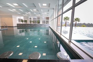 2 indoor pools, outdoor pool, open 8:00 AM to 8:00 PM, pool loungers