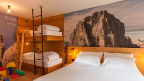 A room with a bunk bed, a ladder, a wooden wall, and a mountain view mural. - Rifugio La Montanara (Molveno)