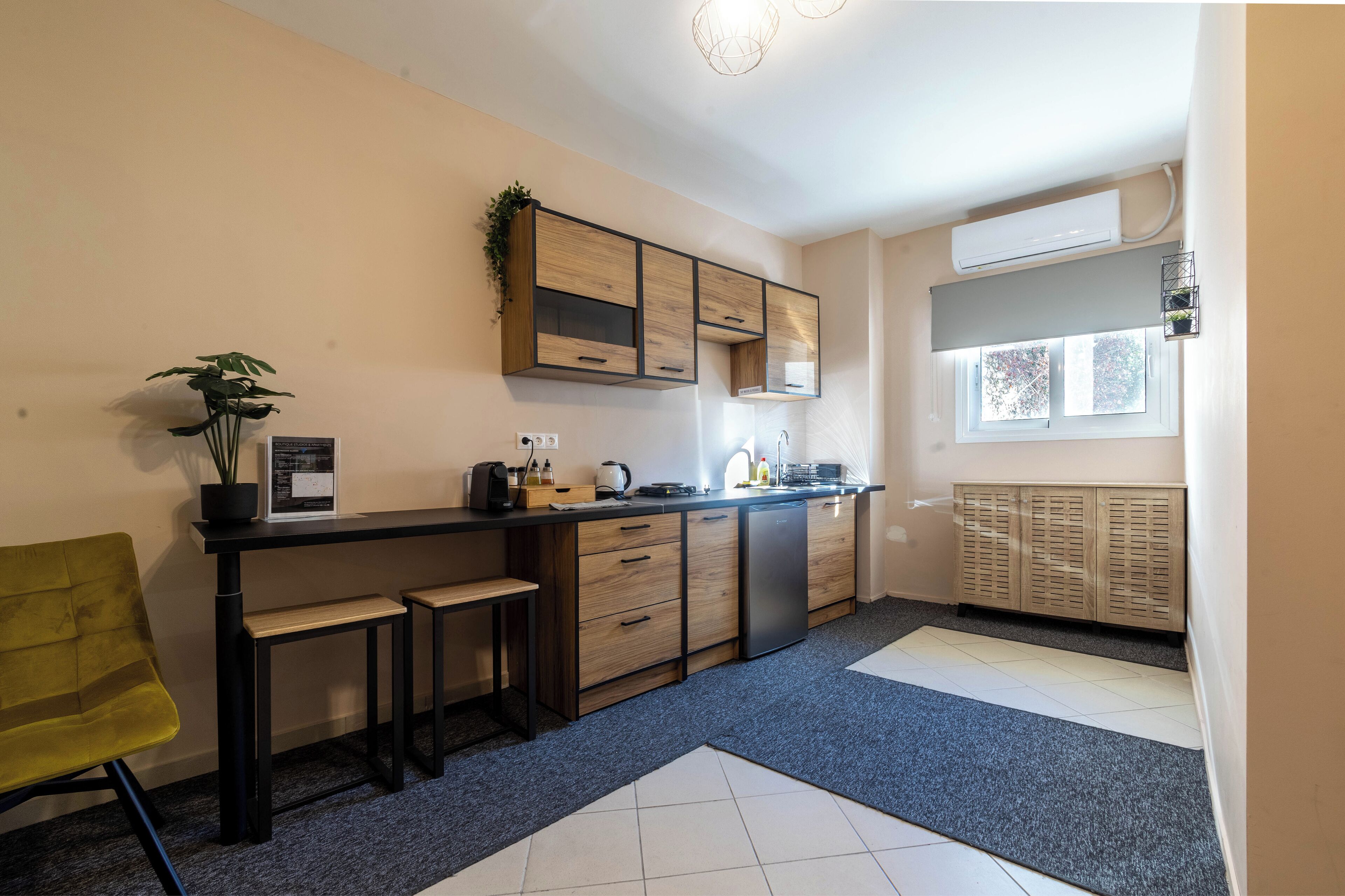 A compact kitchen with a built-in stove, a sink, and a window.