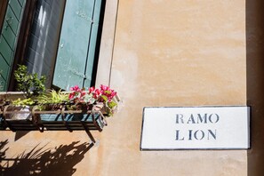 A wall-mounted sign with "RAMO LION" written on it. - Ca Lion (Venice)