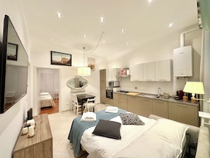 Apartment | Living area | 55-inch Smart TV with digital channels - Vacanze Romane Laterano (Rome)