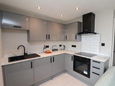 Fridge, electric kettle, toaster, cookware/dishes/utensils