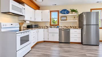 Fully stocked kitchen with plenty of space for your needs.