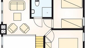 A floor plan with a living area, kitchen, bathroom, and a large bedroom.