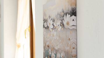 A wall with a floral artwork.
