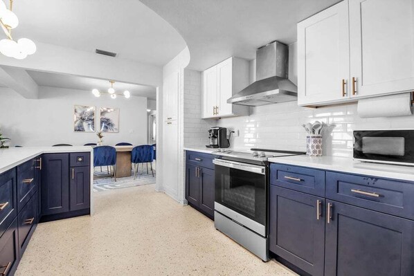 Fridge, microwave, oven, stovetop - Family-Friendly Madeira Beach Retreat w/ Backyard Oasis, Mini Golf & Outdoor Bar (Seminole)