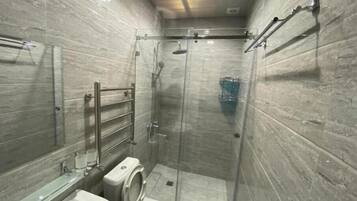 Shower, hair dryer, towels, soap