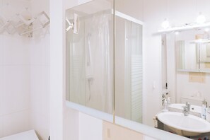 Shower, free toiletries, hair dryer, toilet paper
