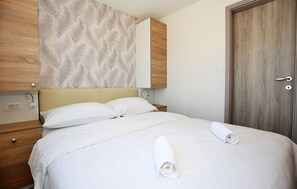 2 室のベッドルーム、WiFi (無料)、ベッドシーツ