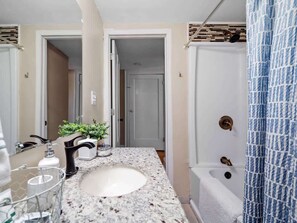 Shower, hair dryer, towels, shampoo