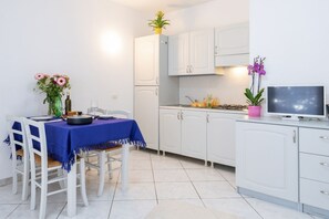 Dining - Two-room apartment of approximately 40 m2 composed of a living room with kitchenette, double sofa bed, double bedroom, bathroom, balcony.Some apartments may also have a bunk bed.Endowed of:- TV- Outdoor chairs, table- External Parking space- Kitchenette- (Badesi)