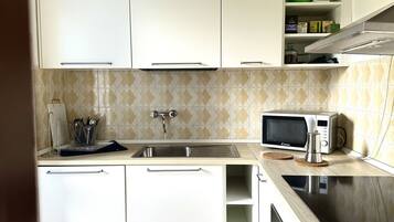 Fridge, oven, dining tables