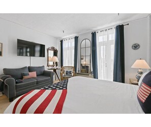 Studio seating by tall balcony doors