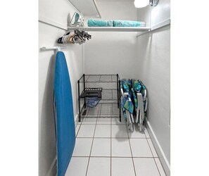 Storage closet with beach chairs