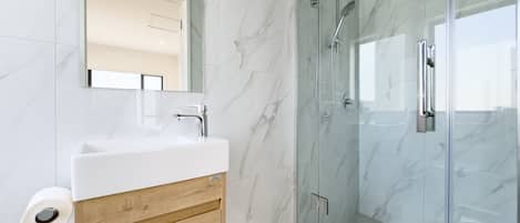Shower, hair dryer, towels, soap