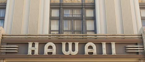 A building with a sign reading 'HAWAII THEATRE' above the entrance.