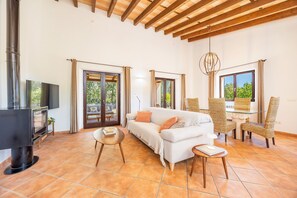 TV, fireplace - Holiday Home 'Na Berganta' with Private Terrace, Private Garden and Wi-Fi (Illes Balears)