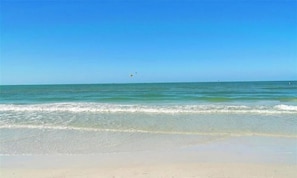 A beach with clear skies and calm waters.