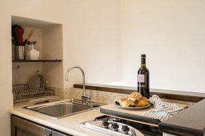 Fridge, microwave, stovetop, cookware/dishes/utensils