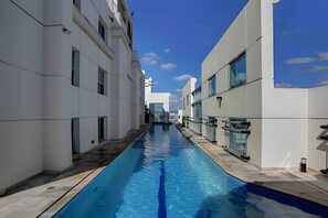 Outdoor pool, pool umbrellas, pool loungers