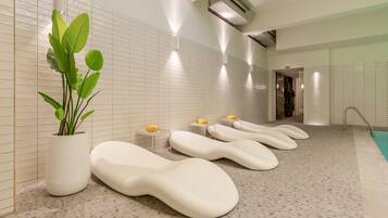 Relax in a serene space with a potted plant, seating benches, and modern side tables.