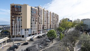A multi-story residential building with a modern architectural design, featuring balconies and large windows. - Almada Saudade by Hopstays | Mezzanine & Charm (Almada)