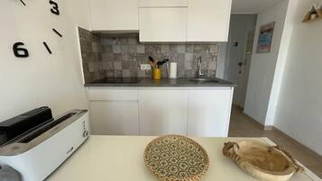 Fridge, microwave, toaster, cookware/dishes/utensils