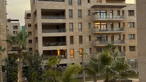 A multi-story residential building with balconies and large windows. - ALSAWAH 3 Bedroom Apartment at Allegria Sodic Sheikh Zayed (Sheikh Zayed City)
