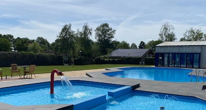 Chalet in a park with indoor and outdoor pool