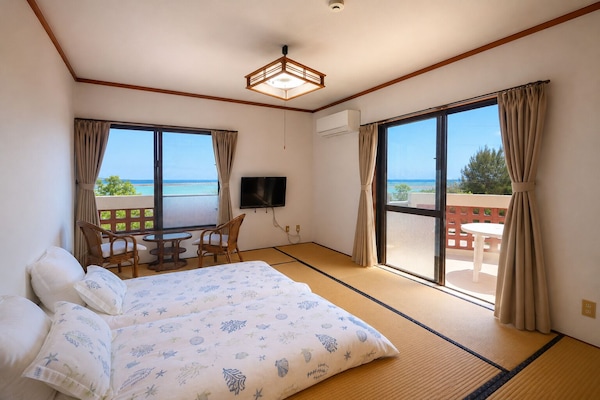 Traditional Twin Room, Beach View | Laptop workspace, WiFi (free), bed sheets