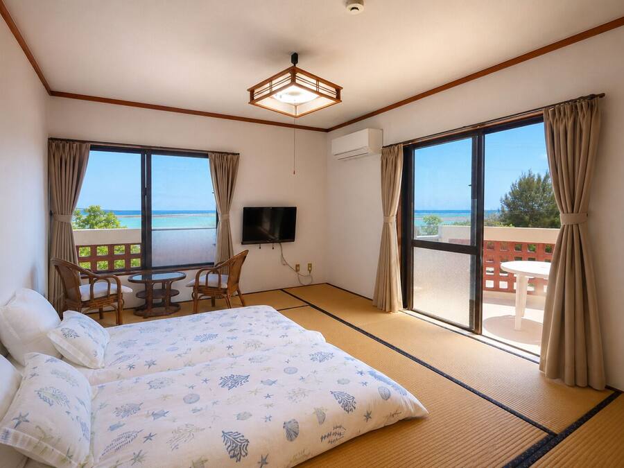 Traditional Twin Room, Beach View | Laptop workspace, WiFi (free), bed sheets